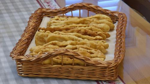 a basket filled with dumplings on a table at Ruralna kuća za odmor Didovina Sinj in Sinj