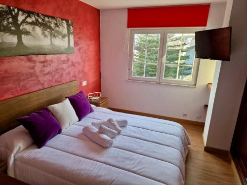 Katil atau katil-katil dalam bilik di Apartamento Noa
