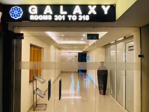 a lobby of a building with a sign that reads gallery at Hotel Galaxy in Allahābād