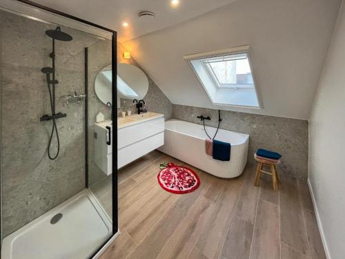 a bathroom with a shower and a tub and a sink at Guesthouse Josephine - Antwerpen in Antwerp