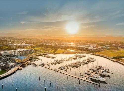 an aerial view of a marina with boats at Casablanca Luxury Retreat near Shellharbour Marina in Shellharbour