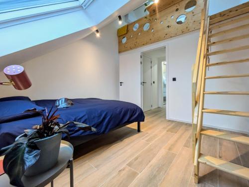 a bedroom with a bunk bed and a ladder at Guesthouse Josephine - Antwerpen in Antwerp
