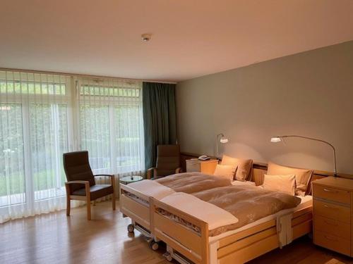Postel nebo postele na pokoji v ubytování Tertianum Parkresidenz Meilen