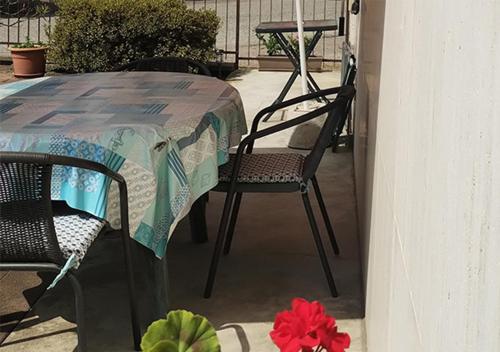 a table and chairs sitting on a patio at Appartamento ZOIA in Crevacuore