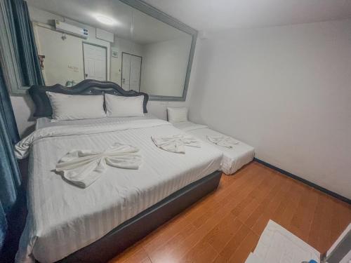 Un ou plusieurs lits dans un hébergement de l'établissement JC House Hotel