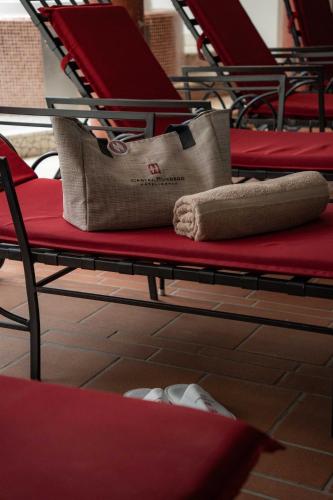 a row of chairs with bags sitting on them at Hotel Castel Rundegg (Adults Only) in Merano
