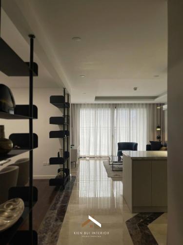 a kitchen and living room with a table and chairs at D’Leroi Soleil - Westlake Suite & Apartment in Hanoi
