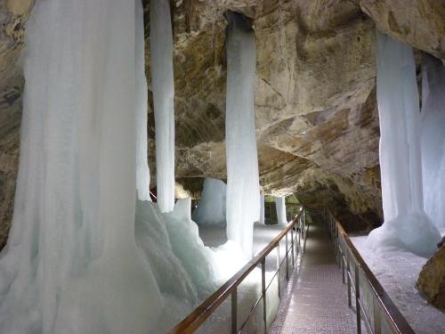 a walkway in a cave with ice formations at Privát Erika in Liptovský Ján