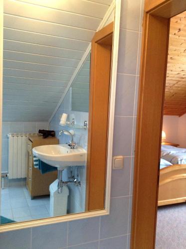 a bathroom with a sink and a mirror at Ferienhof Kriechbaumer in Schönau im Mühlkreis
