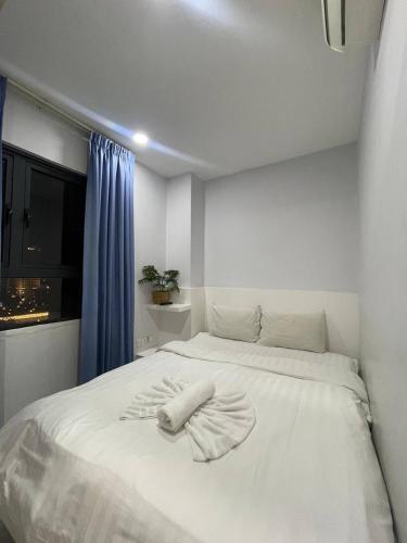Ένα ή περισσότερα κρεβάτια σε δωμάτιο στο Residence 110 (Hotel and Apartments)