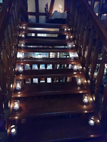 a set of stairs with candles and lights on them at Hotel-Restaurant Bibermühle GmbH in Tengen