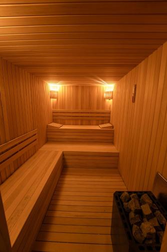 a sauna with two beds in it with lights at Asmalı Konak Cave Suites in Urgup