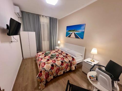 a bedroom with a bed and a tv in it at Affittacamere villa Erbosa in Bologna