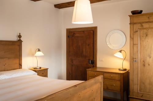 Ein Bett oder Betten in einem Zimmer der Unterkunft Albergo Diffuso Comeglians