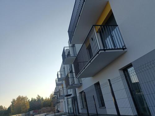 a building with balconies on the side of it at Apartament Malbork in Malbork