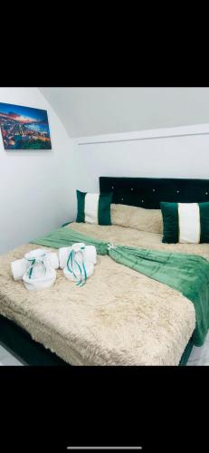 two beds in a room with towels on them at Alex mary home in Naples