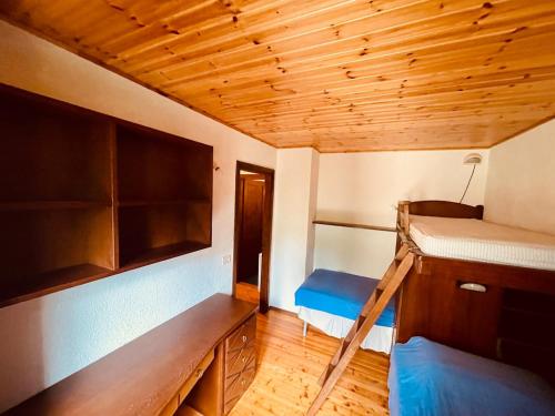 a room with a bunk bed and a ladder at NEW on Bkg! NuovaGrangia Confortable for 2 Families in Grange Sises
