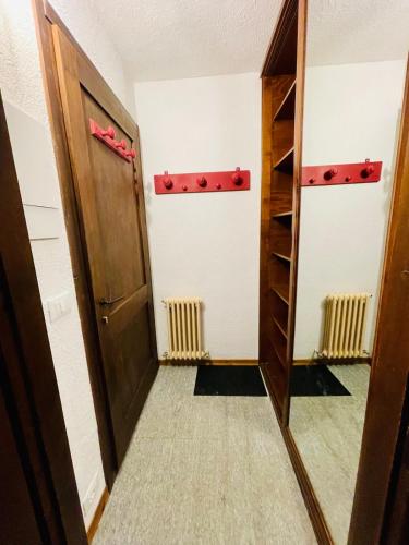 a hallway with a door and a closet at NEW on Bkg! NuovaGrangia Confortable for 2 Families in Grange Sises