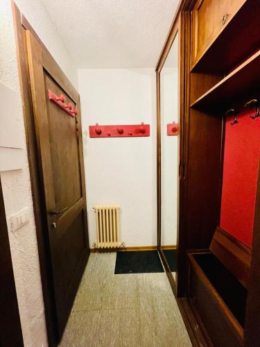 a corridor of a room with a door and a radiator at NEW on Bkg! NuovaGrangia Confortable for 2 Families in Grange Sises