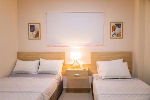 Llit o llits en una habitació de Sunrise Peniel