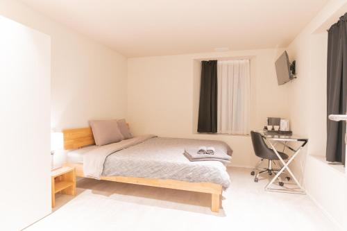 Postel nebo postele na pokoji v ubytování Hotel Rütli am Bahnhof Rüti ZH