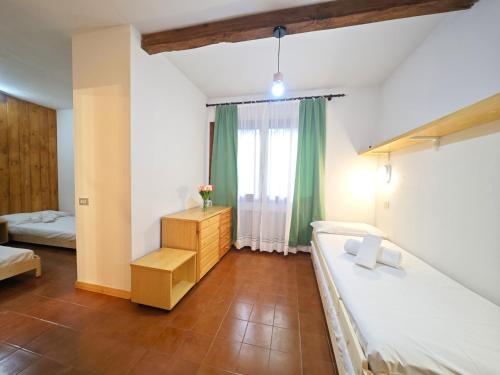Katil atau katil-katil dalam bilik di Hostdomus - Abete Apartment