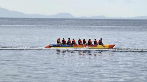 a group of people on a boat in the water at The Philip Ann Resort in Mabini