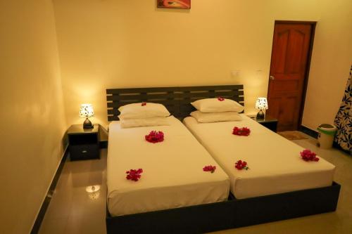 Katil atau katil-katil dalam bilik di Charming Holiday Lodge
