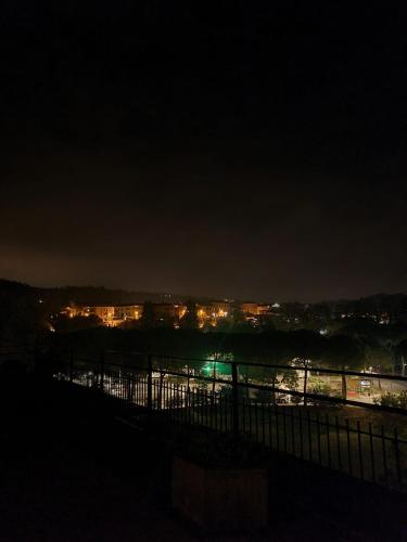 a view of a city at night with lights at Hotel Senio in Riolo Terme