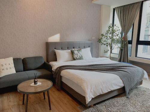 Ένα ή περισσότερα κρεβάτια σε δωμάτιο στο Minilove Homestay