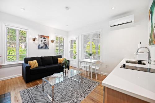 a living room with a couch and a table at Casa Coral in Miami