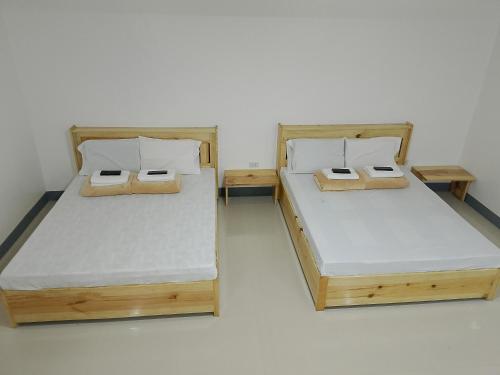 Ένα ή περισσότερα κρεβάτια σε δωμάτιο στο The Sagada Hotel