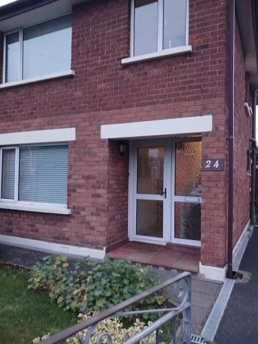 a front door of a red brick building at 2 bed room house available with free parking in Belfast