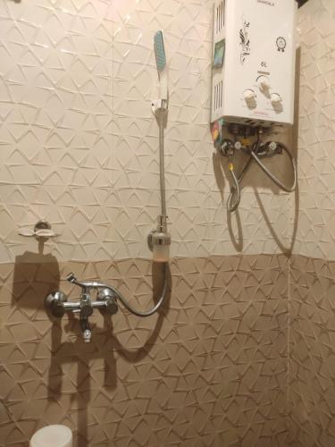 a bathroom with a shower and a toilet at The Mountain Shades Resort in Madikeri