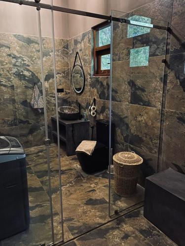 a bathroom with a shower and a sink at Villa Sukka in Tangalle