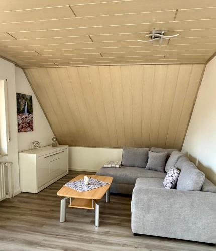 a living room with a couch and a table at Die Kirsche in Achern
