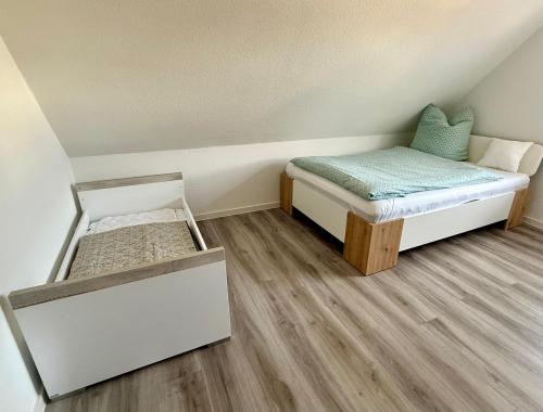 a small room with two beds and a mattress at Die Kirsche in Achern