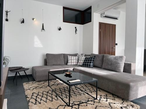 a living room with a couch and a table at Apartment Spanjol in Banjol