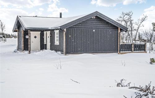 a small house in the snow at Beautiful Home In Engerdal With Kitchen in Kvisla