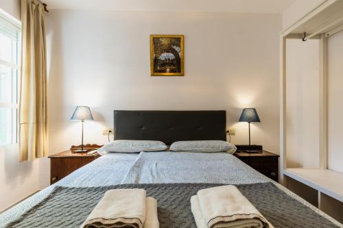 Postel nebo postele na pokoji v ubytování Apartamentos Ruta de la Sierra
