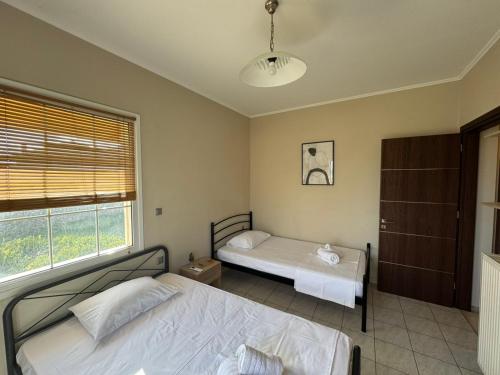 Ένα ή περισσότερα κρεβάτια σε δωμάτιο στο Thealassa Villa