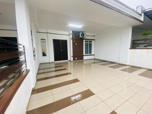 a living room with a tile floor at Alyn Home Batu Pahat VII Netflix Wifi Coway in Batu Pahat