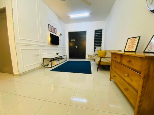 a large living room with a couch and a table at Alyn Home Batu Pahat VII Netflix Wifi Coway in Batu Pahat