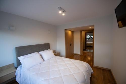 En eller flere senge i et værelse på Casa da Timpeira - Vila Real