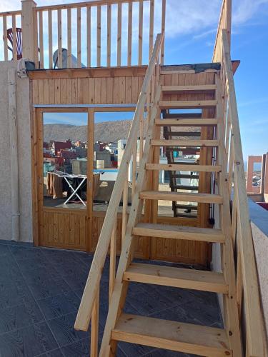 a wooden staircase on the roof of a house at Atlantic coast imssouane in Imsouane