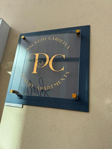 a sign on a wall with the rcp on it at Gli Occhi di Carolina - Palazzo Carolina in Pescara