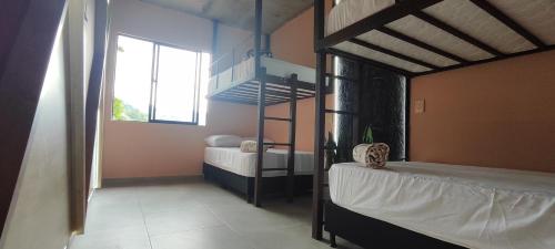 Una cama o camas en una habitación de Glamping Raíces