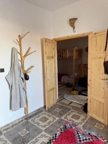 a room with an open door and a rug on the floor at Fisherman House in Wassane