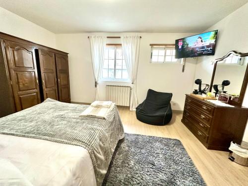 Ένα ή περισσότερα κρεβάτια σε δωμάτιο στο Quarto Eixo Atlântico