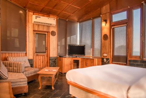 Nandini Villa Dharamshalaにあるテレビまたはエンターテインメントセンター